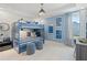 Bedroom with a full-size bunk bed and a desk area at 2416 Cadenza Cir, Dacula, GA 30019