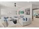 Open concept common area with comfortable seating and access to other rooms at 2416 Cadenza Cir, Dacula, GA 30019