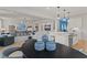 Open concept kitchen with white cabinets and an island at 2416 Cadenza Cir, Dacula, GA 30019