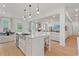 Open concept kitchen with stainless steel appliances and island at 2416 Cadenza Cir, Dacula, GA 30019