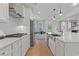 Modern kitchen with stainless steel appliances and herringbone backsplash at 2416 Cadenza Cir, Dacula, GA 30019