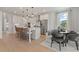 Eat-in kitchen with island, table and hardwood floors at 2416 Cadenza Cir, Dacula, GA 30019