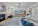 Bright living room with fireplace and large sectional sofa at 2416 Cadenza Cir, Dacula, GA 30019