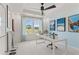 Home office with a desk, window, and ceiling fan at 2416 Cadenza Cir, Dacula, GA 30019