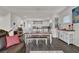 Farmhouse style dining area with a wooden table and bench seating at 3420 Reagan Way # 89, Lawrenceville, GA 30044