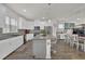 Modern kitchen with white cabinets, granite island, and stainless steel appliances at 3420 Reagan Way # 89, Lawrenceville, GA 30044