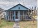 Quaint blue house featuring a screened porch at 374 Hawkins St, Marietta, GA 30060