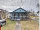 Inviting blue house with a screened porch and walkway at 374 Hawkins St, Marietta, GA 30060