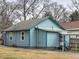 Side view of light blue house with mature trees at 374 Hawkins St, Marietta, GA 30060