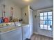 Bright laundry room, featuring washer, dryer, and exterior access at 374 Hawkins St, Marietta, GA 30060