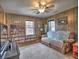 Living room featuring wood paneling, a couch, and built-in shelving at 374 Hawkins St, Marietta, GA 30060