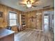 Home office with wood paneling, built in shelving, and hardwood floors at 374 Hawkins St, Marietta, GA 30060