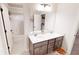 Bathroom featuring double sinks and white tile, perfect for everyday use at 4596 Birch Way, Loganville, GA 30052