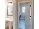 Powder room featuring modern sink and fixtures, and a doorway to the laundry room at 4596 Birch Way, Loganville, GA 30052