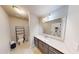 Spacious bathroom with sleek vanity, modern fixtures, and plenty of natural light at 4596 Birch Way, Loganville, GA 30052
