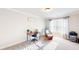 Bright bedroom with a desk, chair, and neutral decor, perfect for relaxation at 4596 Birch Way, Loganville, GA 30052