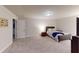 Large bedroom offers comfortable carpeting, ample natural light and generous closet space at 4596 Birch Way, Loganville, GA 30052