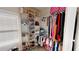 Walk-in closet with custom shelving and ample storage space for clothes and shoes at 4596 Birch Way, Loganville, GA 30052