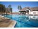 Enjoy community living with a sparkling pool and covered outdoor seating at 4596 Birch Way, Loganville, GA 30052