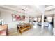 Spacious dining room featuring a farmhouse table, bench seating, and modern lighting, perfect for Gathering gatherings at 4596 Birch Way, Loganville, GA 30052