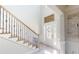 Bright entryway with staircase and decorative accents at 4596 Birch Way, Loganville, GA 30052