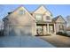 Beautiful two-story home with brick and siding details, featuring an attached garage and manicured lawn in front at 4596 Birch Way, Loganville, GA 30052