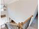 View of the entry foyer from the staircase landing featuring wood floors and natural light at 4596 Birch Way, Loganville, GA 30052