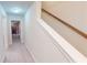 Bright hallway featuring neutral walls, carpet and staircase leading to the upper level at 4596 Birch Way, Loganville, GA 30052
