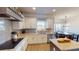 This kitchen offers granite counters, stainless appliances, and a gray backsplash at 4596 Birch Way, Loganville, GA 30052