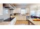 Modern kitchen with stainless steel appliances, granite countertops, and a gray backsplash at 4596 Birch Way, Loganville, GA 30052