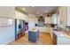 Well-lit kitchen with stainless steel appliances, granite countertops, and light colored cabinetry at 4596 Birch Way, Loganville, GA 30052