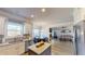 Open concept kitchen featuring stainless appliances, granite counter tops, and a breakfast nook at 4596 Birch Way, Loganville, GA 30052