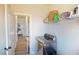 Well-lit laundry room with shelving and a modern washer at 4596 Birch Way, Loganville, GA 30052
