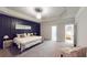 Spacious main bedroom featuring a decorative accent wall and carpeted floors at 4596 Birch Way, Loganville, GA 30052