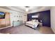 Beautiful primary bedroom with accent wall, tray ceiling, and large windows at 4596 Birch Way, Loganville, GA 30052