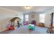 Spacious playroom with lots of natural light, perfect for to play and explore at 4596 Birch Way, Loganville, GA 30052