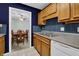 Kitchen with wood cabinets and view of dining area at 2105 Country Park Dr, Smyrna, GA 30080