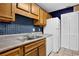 Kitchen with wood cabinets and stainless steel sink at 2105 Country Park Dr, Smyrna, GA 30080