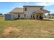 Large backyard features a covered patio, storage shed, and well-maintained lawn at 220 Seth Ter, Mcdonough, GA 30252