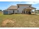 Spacious backyard with patio, shed, and grassy area at 220 Seth Ter, Mcdonough, GA 30252