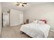 This bedroom boasts a vaulted ceiling, carpet flooring, and an open doorway leading to hallway at 220 Seth Ter, Mcdonough, GA 30252