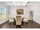 Bright dining room with hardwood floors and chandelier at 220 Seth Ter, Mcdonough, GA 30252