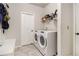 Convenient laundry room with washer, dryer, and storage at 220 Seth Ter, Mcdonough, GA 30252