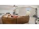 Spacious living room with a large sectional couch and natural light from two windows at 220 Seth Ter, Mcdonough, GA 30252