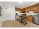 Kitchen featuring stainless steel appliances, wooden cabinets and light hardwood floors at 563 Memorial Se Dr # 211, Atlanta, GA 30312