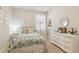 Cozy bedroom with white dresser and metal bed frame at 5750 Sutters Vw, Cumming, GA 30028