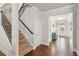 Bright entryway with hardwood floors and staircase at 5750 Sutters Vw, Cumming, GA 30028