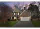 Two story home with brick facade and two car garage at 5750 Sutters Vw, Cumming, GA 30028