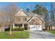 Two story home with brick facade and two car garage at 5750 Sutters Vw, Cumming, GA 30028