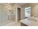 Bathroom boasts a large shower and double vanity at 628 Leafy Branch Way, Mcdonough, GA 30253